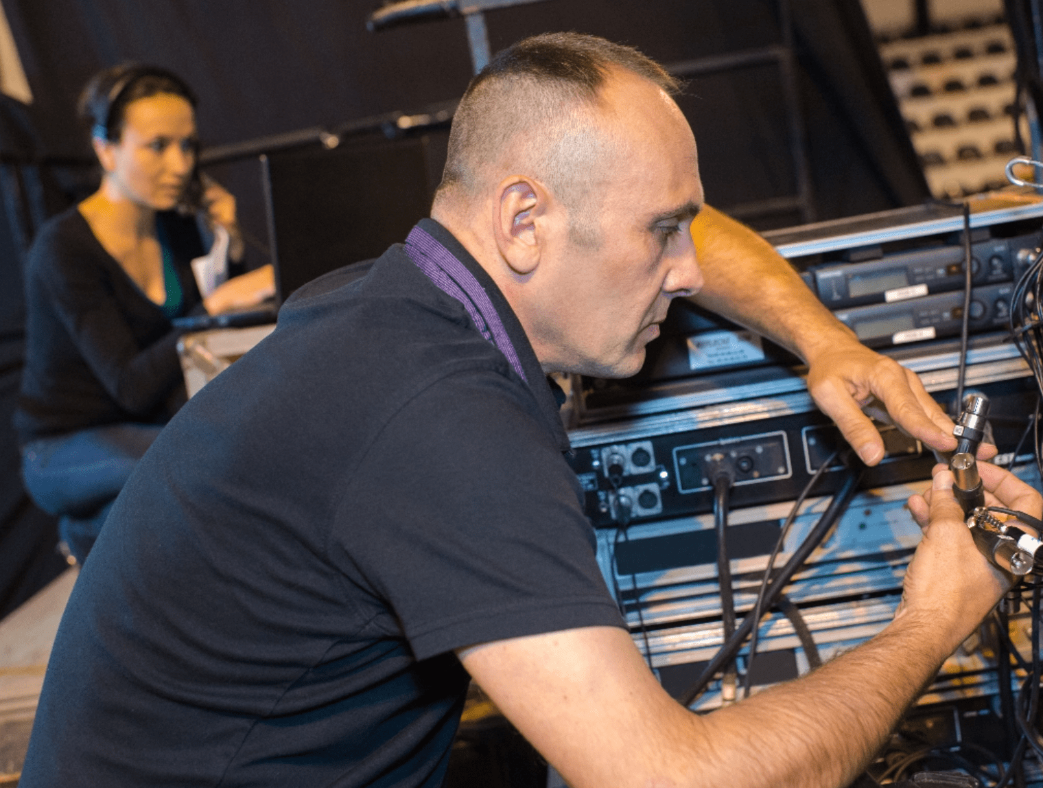 Man Adjusting Equipment